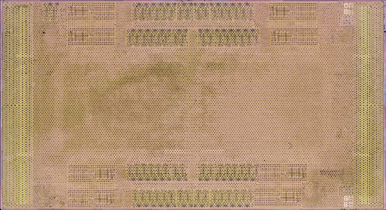 Magnified top metal of an exposed server-processor I/O die showing patterned functional regions.